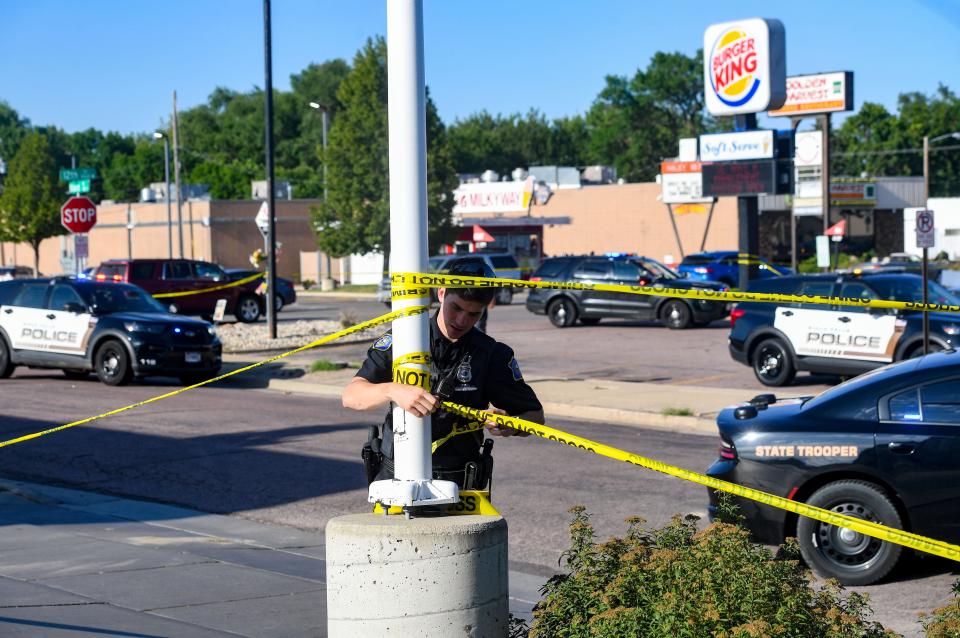 A crime scene is established after shots fired at the Burger King on 12th Street on Tuesday, August 9, 2022, in Sioux Falls.