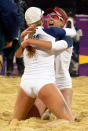 April Ross (R) and Jennifer Kessy from the US celebrates at the end of the women's Beach Volleyball semifinal against Brazil's Larissa Franca and Juliana Silva on the Centre Court Stadium in Horse Guards Parade on London on August 7, 2012, for the London 2012 Olympic Games. The US won 2-1 AFP PHOTO / DANIEL GARCIADANIEL GARCIA/AFP/GettyImages