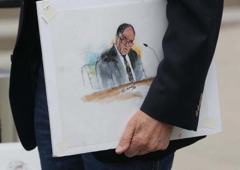 A courtroom artist holds a rendering of suspended Los Angeles City Council member Mark Ridley-Thomas.