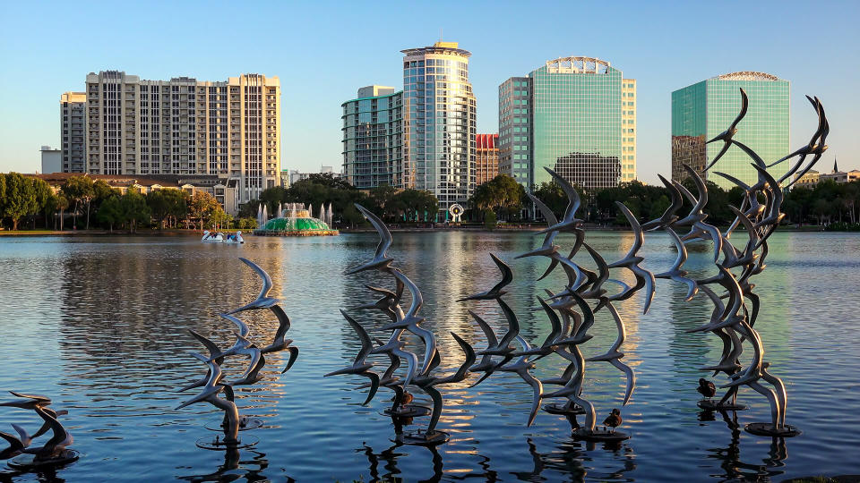 ORLANDO, FLORIDA - MAY 21st: Sculpture art of seagulls taking flight at Lake Eola Park in Orlando, Florida on May 21st, 2016.