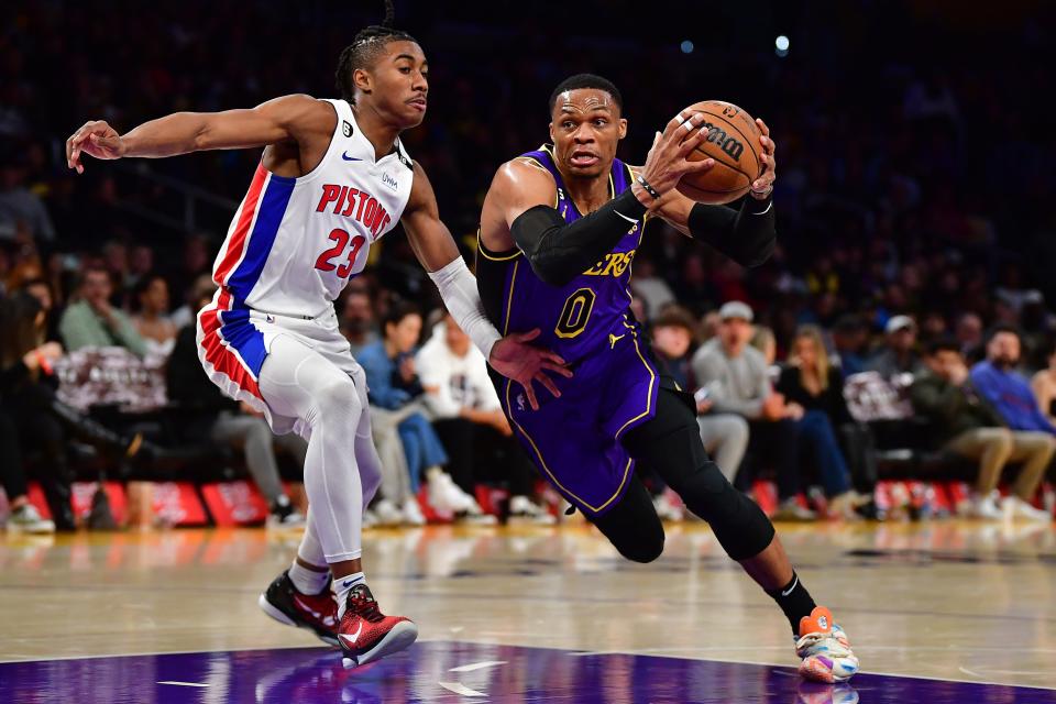 Los Angeles Lakers guard Russell Westbrook drives to the basket against Detroit Pistons guard Jaden Ivey during the second half at Crypto.com Arena, Nov. 18, 2022 in Los Angeles.