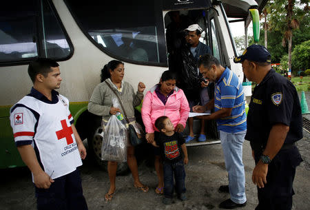 People who were evacuated from their homes arrive at a school used as a shelter while Storm Otto approaches in Guapiles, Costa Rica November 23, 2016. REUTERS/ Juan Carlos Ulate