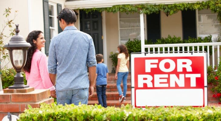 Hispanic family outside a rental residence