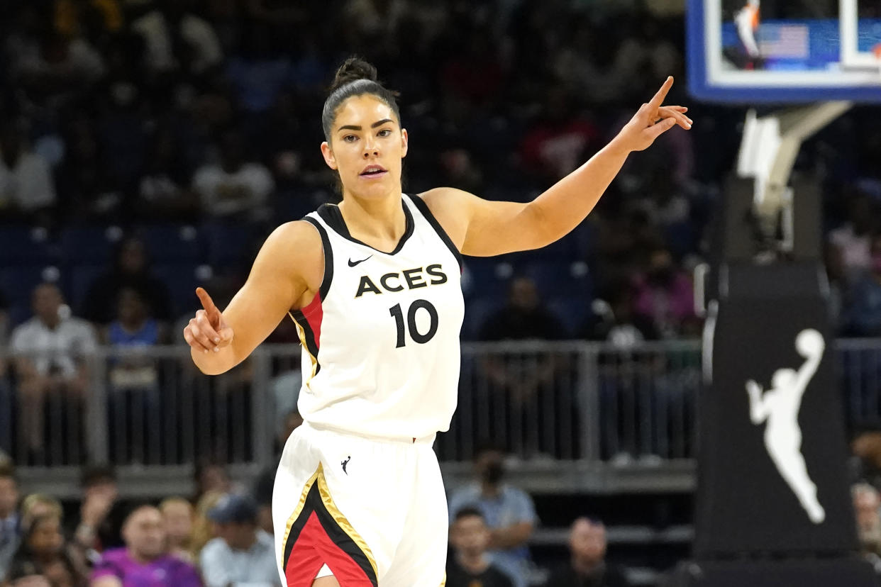 Las Vegas Aces' Kelsey Plum reacts after scoring during the the WNBA Commissioner's Cup basketball game against the Chicago Sky Tuesday, July 26, 2022, in Chicago. (AP Photo/Charles Rex Arbogast)