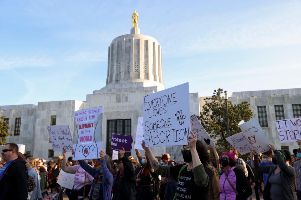 People march to oppose the possible overturning of federal abortion protections following the leaked draft of a U.S. Supreme Court opinion that would overturn Roe v. Wade, at the Oregon State Capitol in Salem, Ore., on Tuesday, May 3, 2022.