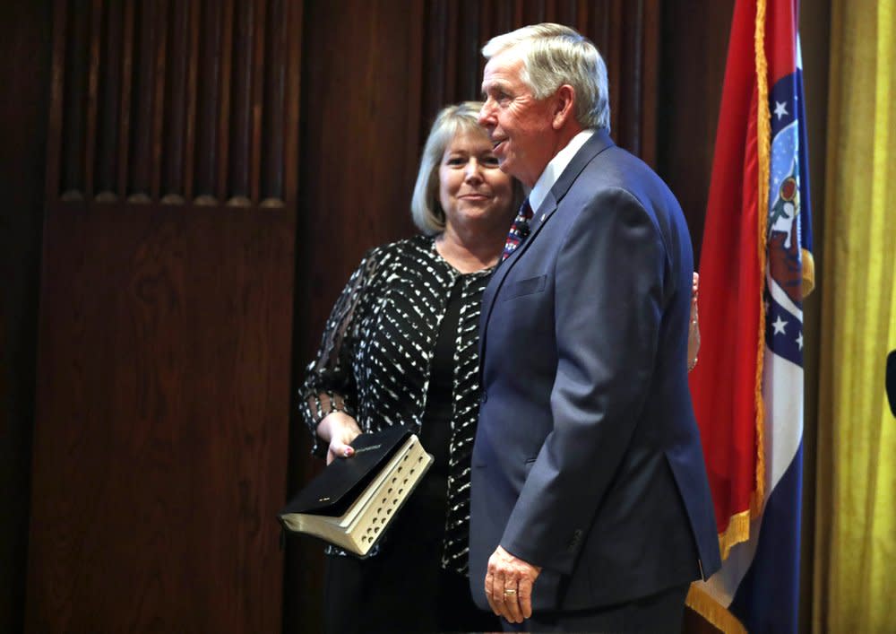 In this June 1, 2018 file photo, Gov. Mike Parson, right, smiles along side his wife, Teresa, after being sworn in as Missouri’s 57th governor in Jefferson City, Mo. (AP Photo/Jeff Roberson, File)