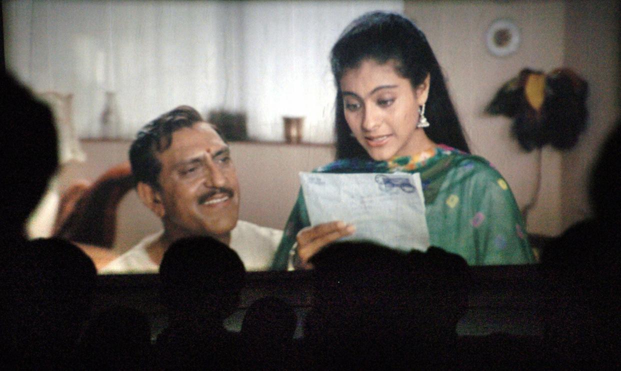 Movie goers watch the popular hindi film Dilwale Dulhania Le Jayenge (The Brave hearted Will Take The Bride Away) at the city's prestigious Maratha Mandir movie hall in its matinee show in Bombay 09 May 2005.