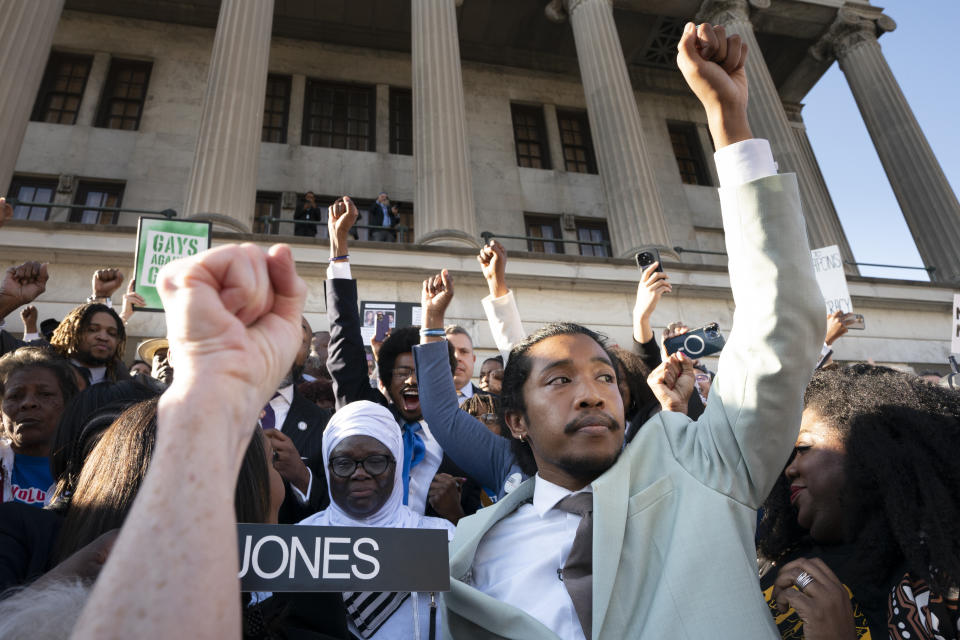 State Rep. Justin Jones, D-Nashville, raises his fist to the crowd after taking the oath of office on the steps of the state Capitol, Monday, April 10, 2023, in Nashville, Tenn. Jones was appointed to represent District 52 by the Metro Nashville City Council after being expelled the previous week for using a bullhorn to shout support for pro-gun control protesters in the House chamber. (AP Photo/George Walker IV)