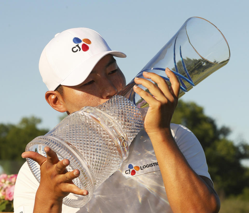 Sung Kang, of South Korea, kisses the trophy after winning the Byron Nelson golf tournament on Sunday, May 12, 2019, in Dallas. (AP Photo/Richard W. Rodriguez)