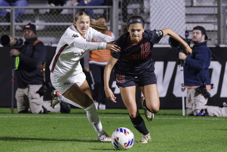 Stanford's Avani Brandt (18) and Florida State's Kaitlyn Zipay, left, battle for a ball during the first half of the NCAA college women's soccer tournament final in Cary, N.C., Monday, Dec. 4, 2023. (AP Photo/Ben McKeown)