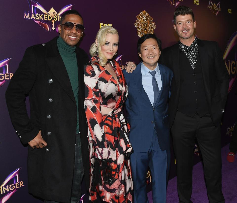Masked Singer: Cannon with his colleagues, Jenny McCarthy, Ken Jeong and Robin Thicke (Jon Kopaloff/Getty Images)