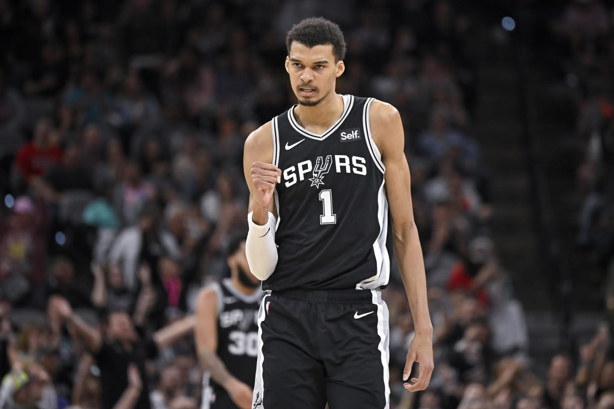 San Antonio Spurs' Victor Wembanyama celebrates a basket during the second half of an NBA basketball game against the Houston Rockets, Tuesday, March 12, 2024, in San Antonio. Houston won 103-101. (AP Photo/Darren Abate)