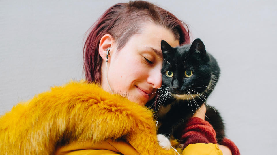 Lady hugging cat