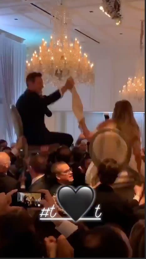 In keeping with Jewish traditions, Trevor and Tracey were hoisted up on chairs in the middle of the dancefloor and held hands while they were celebrated. Photo: Instagram/tracytutor 