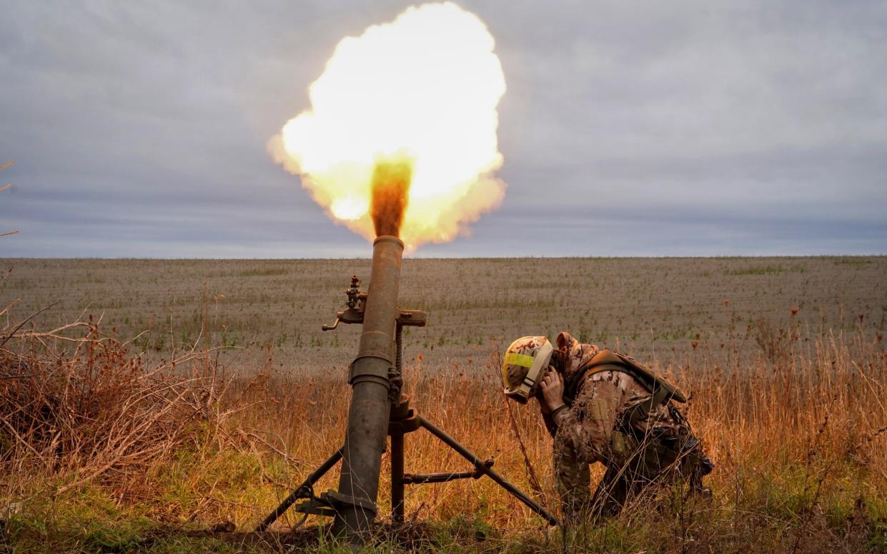 Ukrainian soldiers fire at Russian positions near Kharkiv