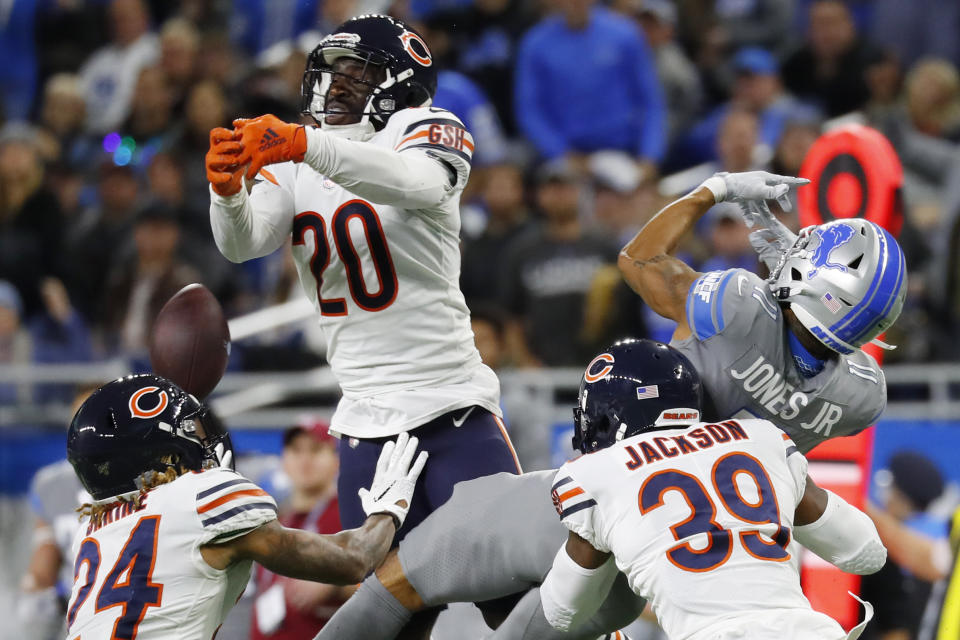 Chicago Bears cornerback Prince Amukamara (20), free safety Eddie Jackson (39), and cornerback Buster Skrine (24) help break up the pass intended for Detroit Lions wide receiver Marvin Jones (11) during the second half of an NFL football game, Thursday, Nov. 28, 2019, in Detroit. (AP Photo/Paul Sancya)