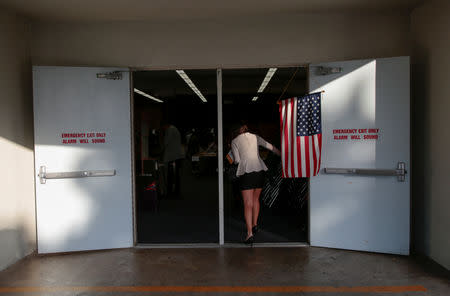 Voters drop off mail-in midterm election ballots at the Andrew Jackson Elementary School in Santa Ana, California, U.S. November 6, 2018. REUTERS/Kyle Grillot
