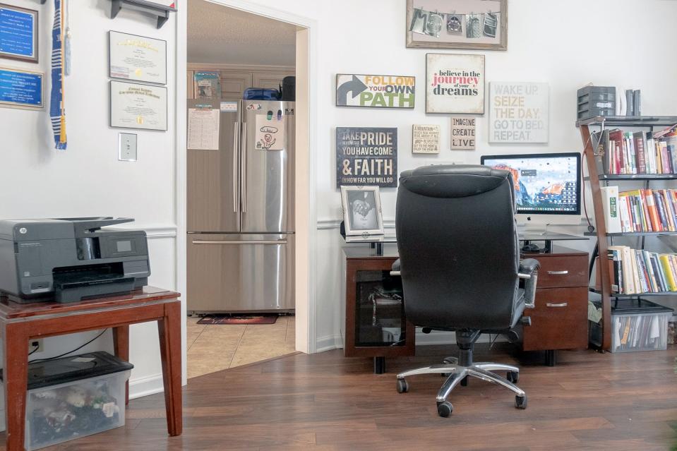 The in-home office has plenty of work space as well as needed storage for all the necessities.