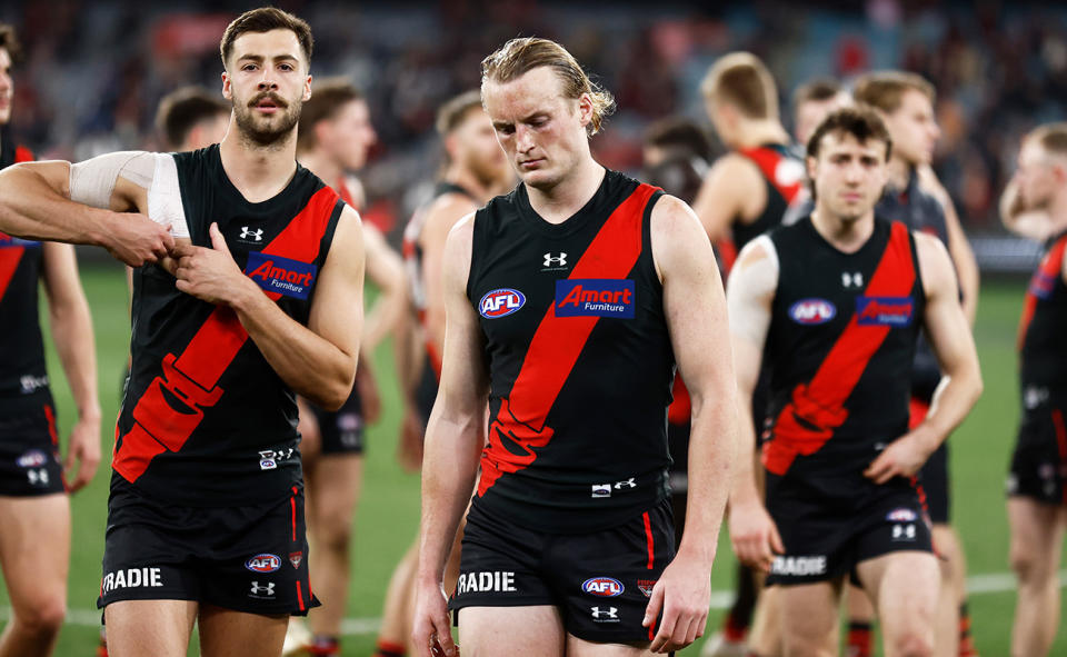 Essendon players, pictured here after their brutal loss to Collingwood.