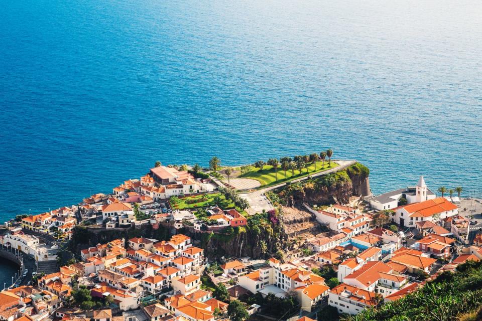 <p>Incredibly lush, the Portuguese island of Madeira feels like a mix between a tropical vacation and a European town. Make sure you swim in the natural swimming pool of Porto Moniz, hike the Vereda dos Balcões up to the lookout point for panoramic views, and see in the Risco waterfall in the island's leafy forest. </p>