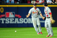 Matt Holliday #7 and Pete Kozma #38 of the St. Louis Cardinals react after the ball hits the grass as the infield fly rule is called in the eighth inning on a ball hit by Andrelton Simmons #19 of the Atlanta Braves during the National League Wild Card playoff game at Turner Field on October 5, 2012 in Atlanta, Georgia. (Photo by Scott Cunningham/Getty Images)