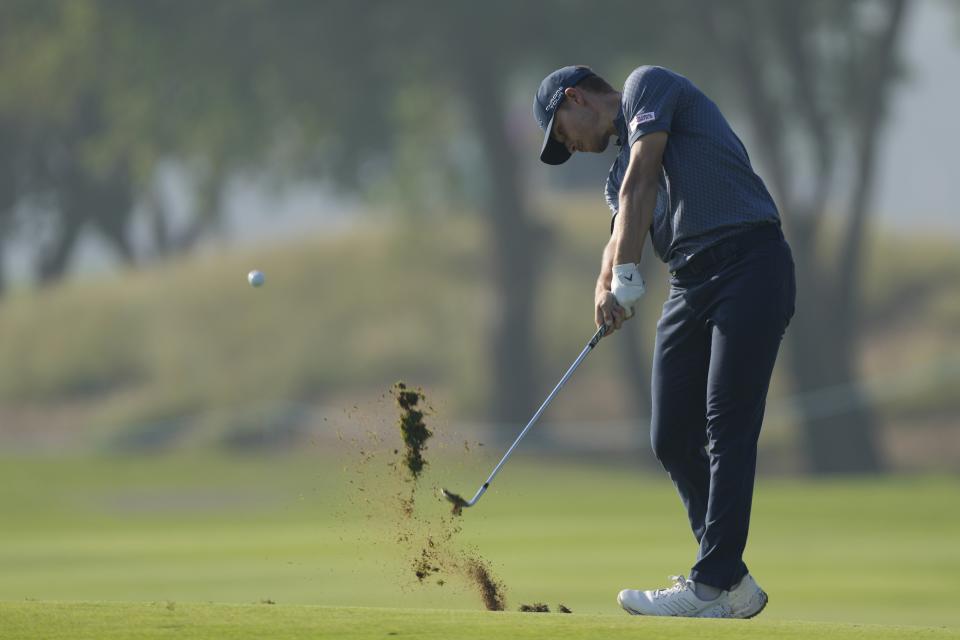 Nicolai Hojgaard of Denmark plays his second shot on the 11th hole during the second round of Dubai Invitational golf tournament, in Dubai, United Arab Emirates, Friday, Jan. 12, 2024. (AP Photo/Kamran Jebreili)