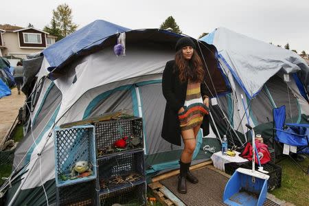 Kalaniopua Young, 32, originally from Hawaii, poses outside her tent at SHARE/WHEEL Tent City 3 outside Seattle, Washington October 12, 2015. REUTERS/Shannon Stapleton