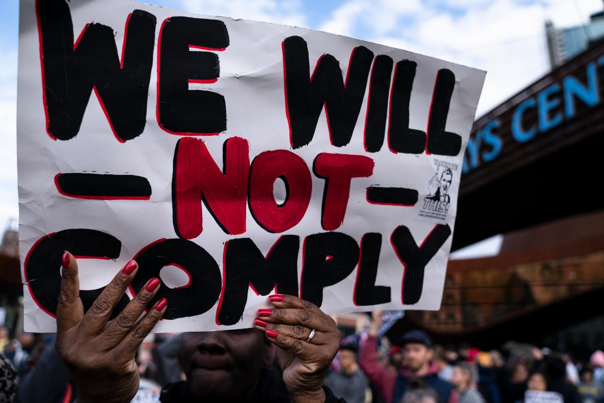 Protesters rallying against COVID-19 vaccination mandates gather in the street outside the Barclays Center before an NBA basketball game between the Brooklyn Nets and the Charlotte Hornets Oct. 24 in New York.