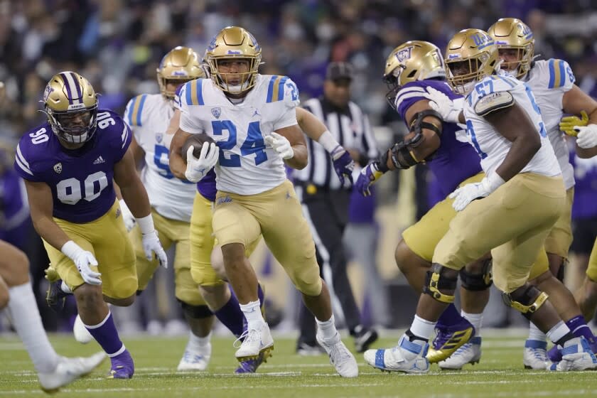 UCLA running back Zach Charbonnet (24) rushes against Washington.