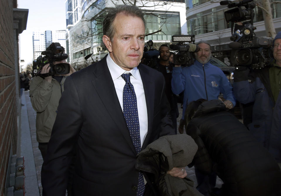 FILE - Gordon Ernst, former Georgetown tennis coach, departs federal court on March 25, 2019, in Boston after facing charges in a nationwide college admissions bribery scandal. Ernst is scheduled to be sentenced on Friday July 1, 2022. (AP Photo/Steven Senne, File)
