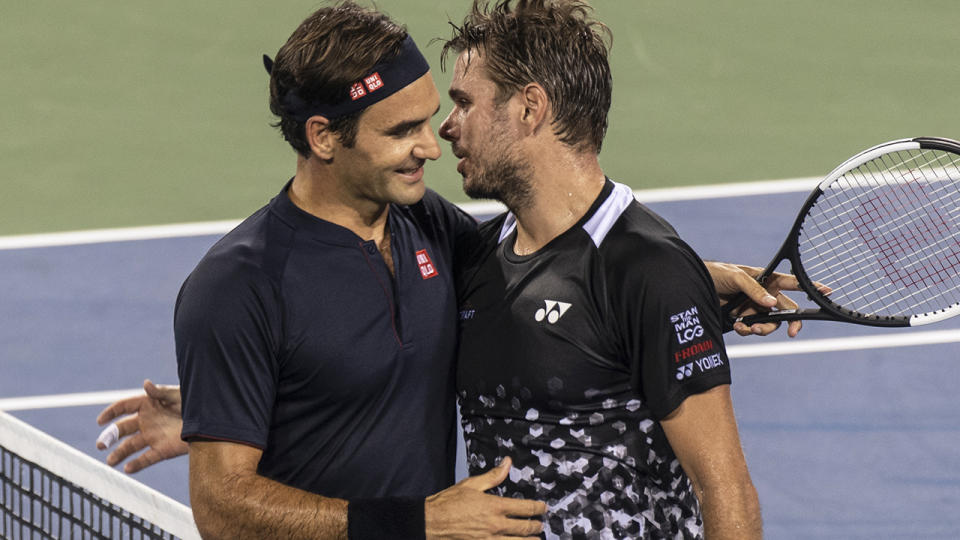 Roger Federer shakes hands with Stan Wawrinka after their match on Day 6 of the Western and Southern Open. (Photo by Shelley Lipton/Icon Sportswire via Getty Images)