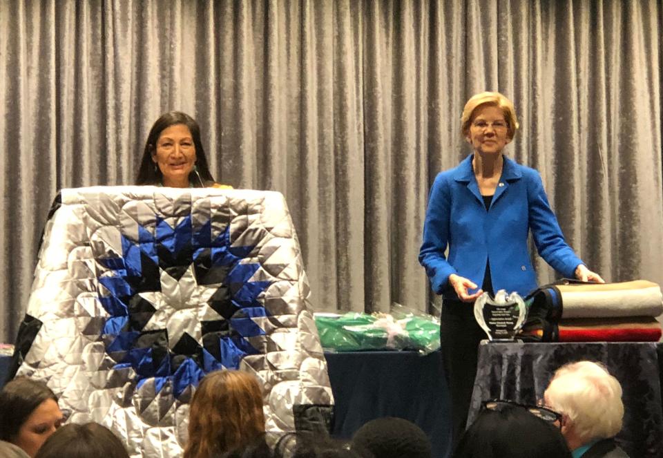 Rep. Deb Haaland (D-N.M.) introducing Sen. Elizabeth Warren (D-Mass.) at&nbsp;the National Indian Women&rsquo;s &ldquo;Supporting Each Other&rdquo; lunch. (Photo: Crystal Echohawk)