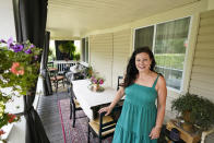 Heather Bise, owner of The House of Bise Bespoke, poses on the front porch where she entertains guests, Monday, July 19, 2021, in Cleveland. Small businesses in the U.S. that depend on tourism and vacationers say business is bouncing back, as people re-book postponed trips and take advantage of loosening restrictions, a positive sign for the businesses that have struggled for more than a year. Bise started in 2019 and catered to international tourists, attracting guests from New Zealand, Botswana, Eastern Europe and elsewhere. (AP Photo/Tony Dejak)