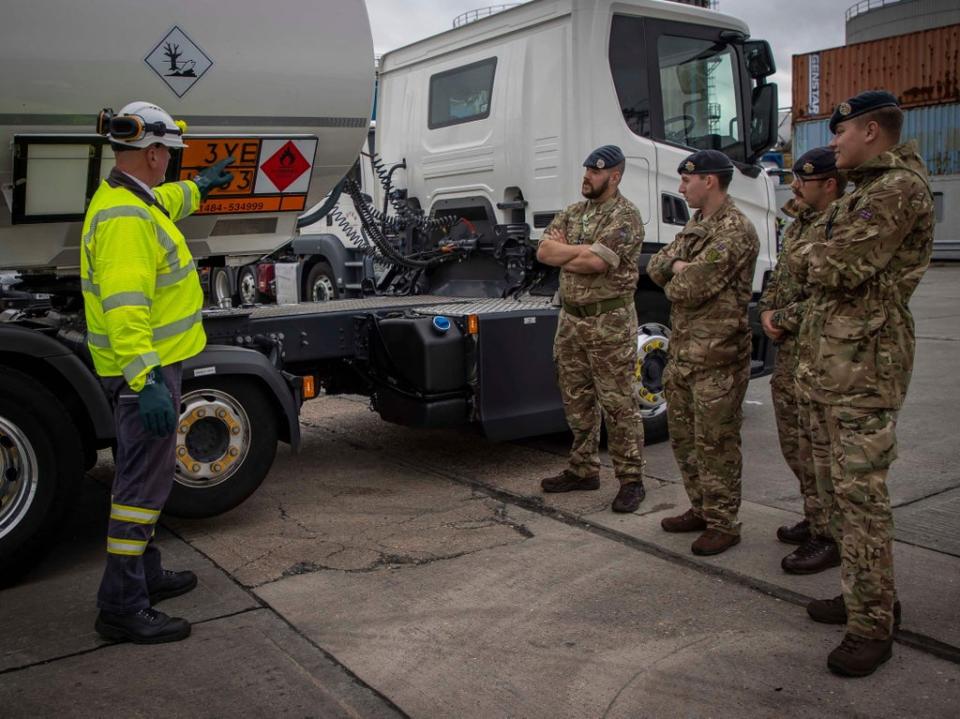 A driver training instructor for Hoyer Petrolog UK shows Army and RAF driver important features of fuel tankers (MoD/AFP via Getty Images)