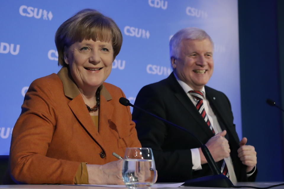 German chancellor and head of the German Christian Democrats, Angela Merkel, left, and Bavarian governor and head of the Christian Social Union party, Horst Seehofer, brief the media during a news conference after a party meeting in Munich, Germany, Monday, Feb. 6, 2017. Merkel was meeting her Bavarian conservative allies in a show of unity following a long-running argument over migrant policy, setting the scene for a joint campaign for German elections in September. (AP Photo/Matthias Schrader)