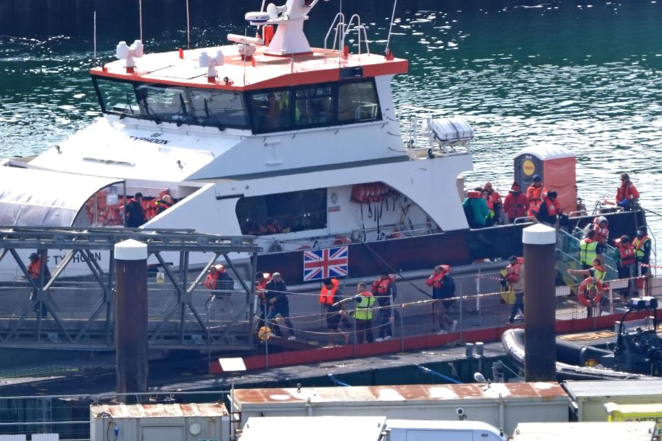 A group of people thought to be migrants are brought in to Dover, Kent, from a Border Force vessel following a small boat incident in the Channel (PA Wire)