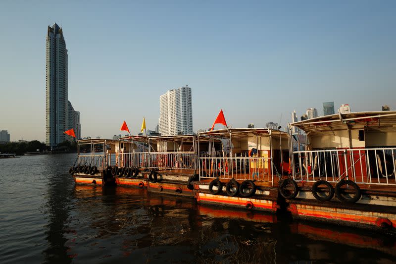 Boats that are used to transport tourists around the Chao Phraya river are seen idle in downtown Bangkok