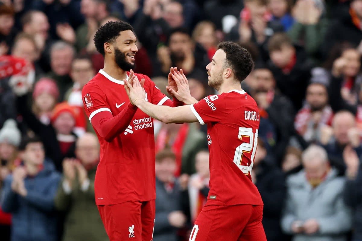 Gomez celebrates with Diogo Jota in Liverpool’s 5-2  win over Norwich City in the FA Cup (Getty)