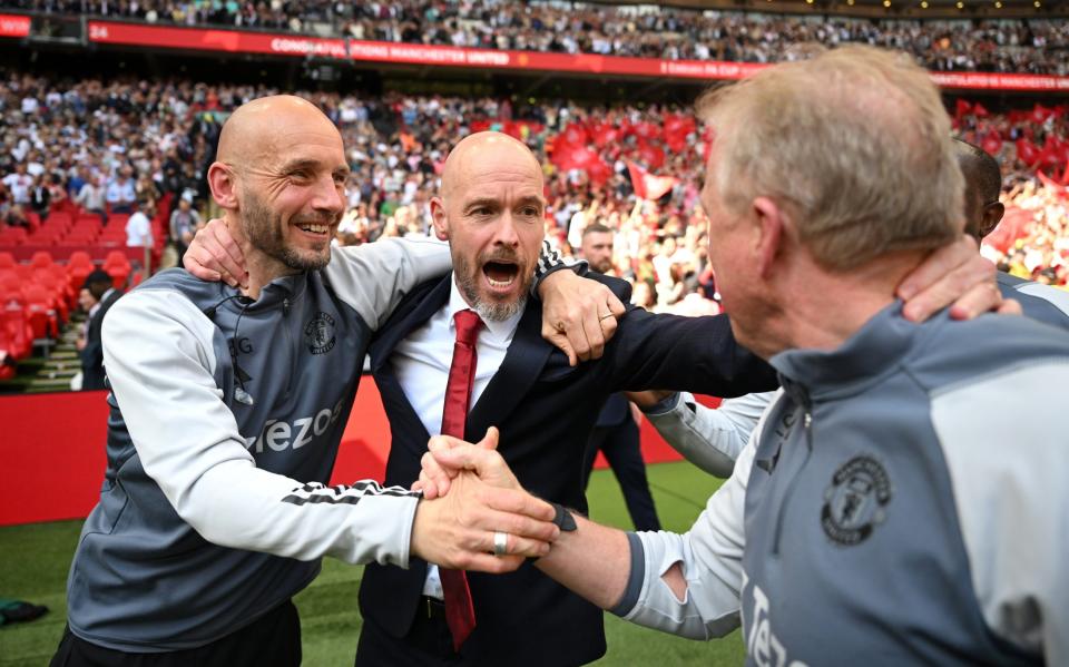 Erik ten Hag, Manager of Manchester United, and Mitchell van der Gaag, Assistant Manager of Manchester United interacts with Steve McClaren, Assistant Coach of Manchester United during the Emirates FA Cup Final match between Manchester City and Manchester United at Wembley Stadium on May 25, 2024 in London, England