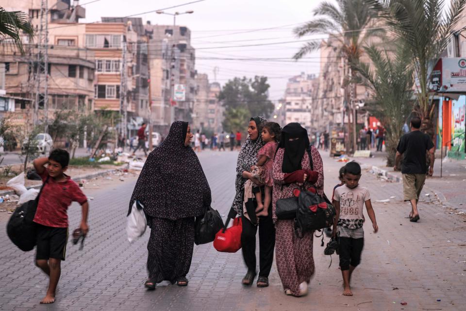 Women and children flee from Gaza City on Oct. 11, 2023, as Israel stepped up rocket attacks and tightened a blockade on food, fuel and medicines. The Gaza Strip, a Palestinian enclave of about 2.3 million people, is less than half the size of New York City. Terrorist group Hamas won the 2006 parliamentary elections and in 2007 seized control of the Gaza Strip from the internationally recognized Palestinian Authority.