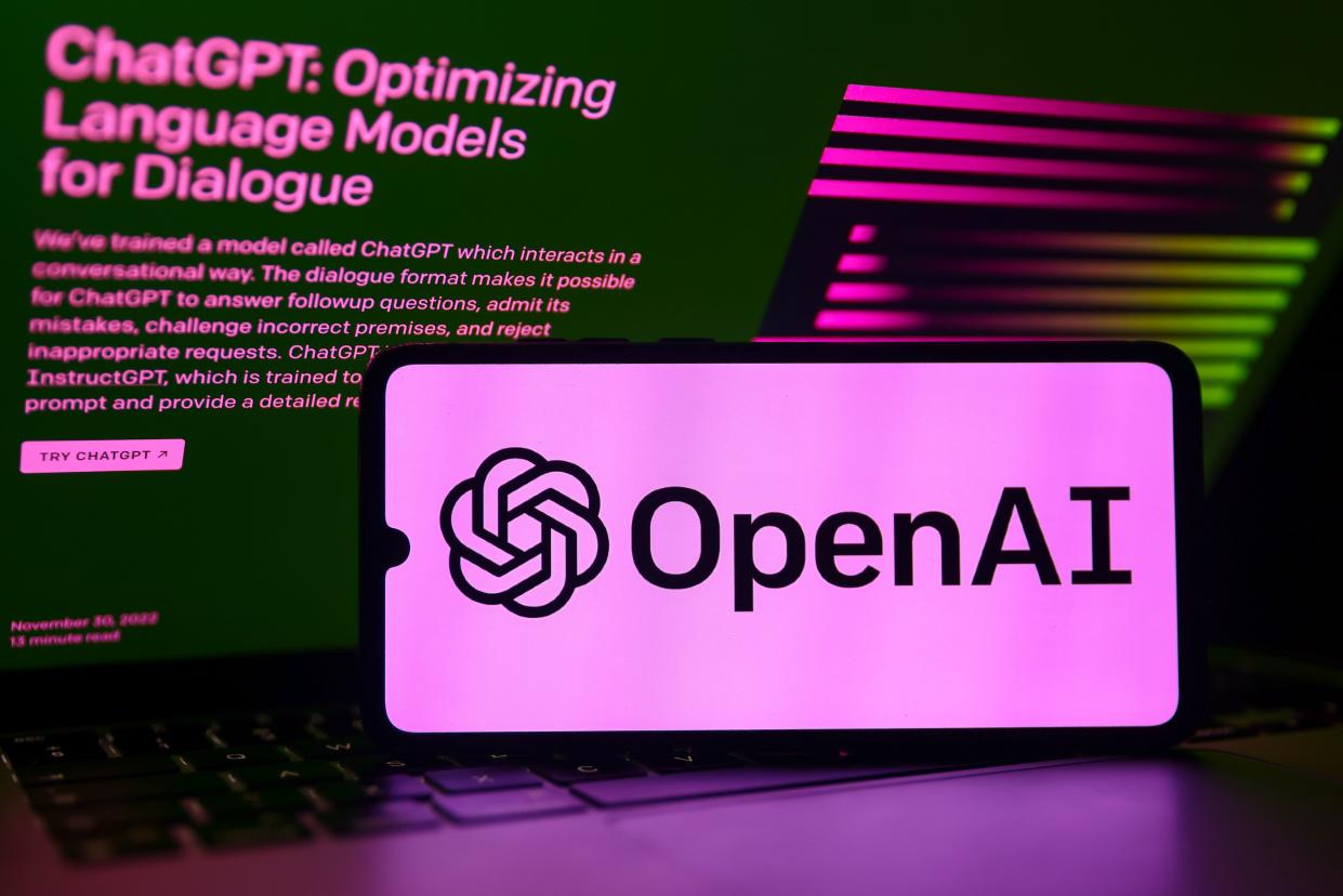 Picture of phone that displays OpenAI logo.
