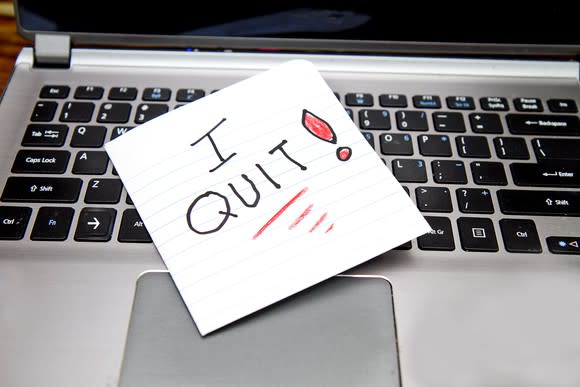 I QUIT note on a computer keyboard