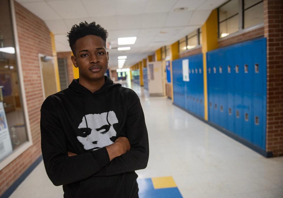 Junior Mike Lowery poses for a photo at Wingfield High School in Jackson on Tuesday, May 14, 2024. "I don't really have a problem going to a new school. It's just that I don't want to leave Wingfield," Lowery said. "I wanted to graduate from here."