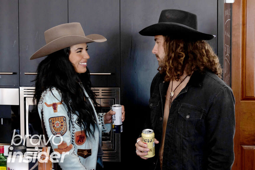 Danielle Olivera and Alex Propson having a conversation while at a party together.