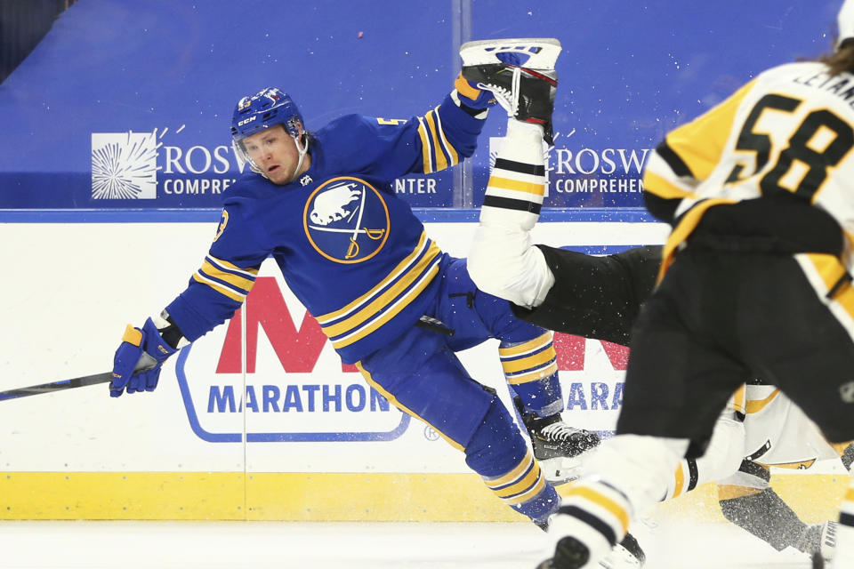 Buffalo Sabres forward Jeff Skinner (53) collides with a Pittsburgh Penguins player during the first period of an NHL hockey game, Saturday, April 17, 2021, in Buffalo, N.Y. (AP Photo/Jeffrey T. Barnes)