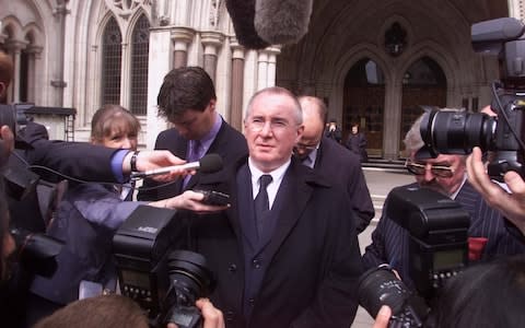 Elton John's former manager John Reid outside the high court in 2001 - Credit: Heathcliffe O'Malley