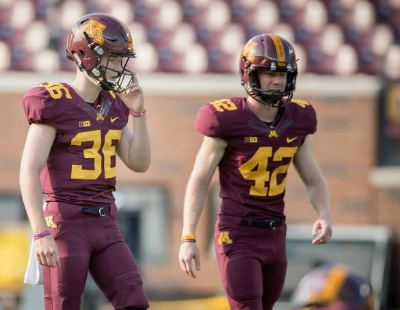 Casey O’Brien (L) stands next to a Minnesota kicker during the Gophers’ spring game. (Photo credit: Casey O’Brien family)