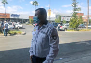 Edgar Alexis Lopez stands outside a market in Tijuana, Mexico on Oct. 10, 2020. President Donald Trump’s reshaping of U.S. immigration policy may be most felt in his undoing of asylum. “You enter and leave, enter and leave, enter and leave,” Lopez said.“You have nothing to lose besides the physical strain.” (AP Photo/Elliot Spagat)