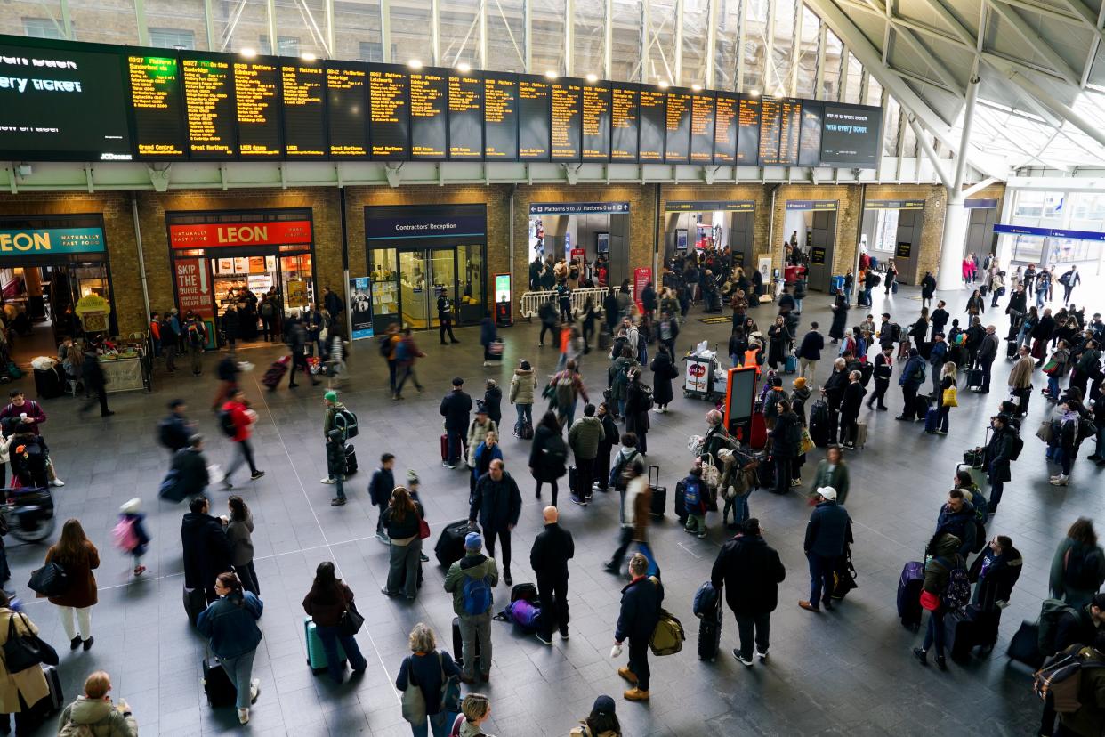 Passengers waiting for trains at London King's Cross Station on Good Friday (Jordan Pettitt/PA Wire)