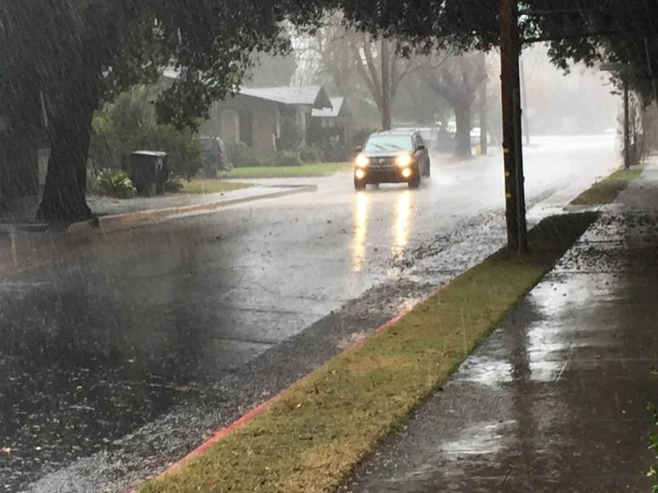 Heavy rain falls Saturday on Morris Avenue in Modesto.